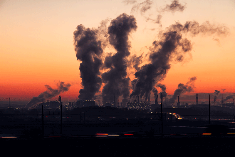 factory smoke stacks emit air pollution